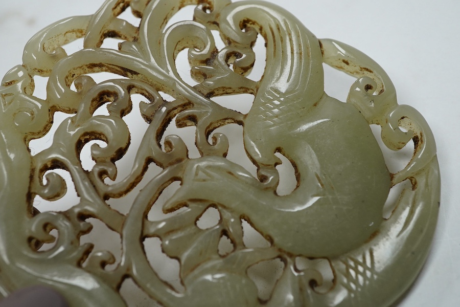 A 19th century Chinese reticulated celadon jade disc, 6.5cm diameter, a Ming style peach shaped brushwasher and a neolithic style carving. Condition - good